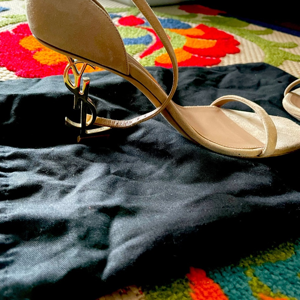 A soft suede finish contrasts the polished goldtone YSL-shaped heel. 36 1/2
